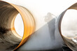Manual sandblasting or abrasive blasting to metal pipe. Abrasive blasting, more commonly known as sandblasting, is the operation of forcibly propelling a stream of abrasive material against a surface.