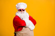 Turned photo of white bearded santa claus in culinary chef headwear cap cross hands cook x-mas christmas jolly meal wear apron sunglass isolated bright shine color background