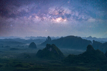 Wall Mural - landscape view of the mountains and colorful milky way galaxy with stars space in night sky. recreat