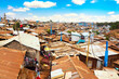 Kibera slum in Nairobi during sunny day with blue sky and clouds. Kibera is the biggest slum in Africa. Slums in Nairobi, Kenya.