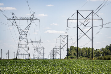 Blue skies white clouds detailed electrical pylons. high voltage