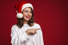 Happy Cheery Young Woman In Christmas Santa Hat