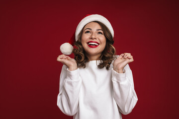 Wall Mural - Young woman in christmas santa hat