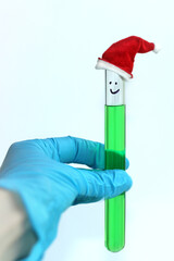 a test tube with a green solution with a decorative red cap in the chemical laboratory