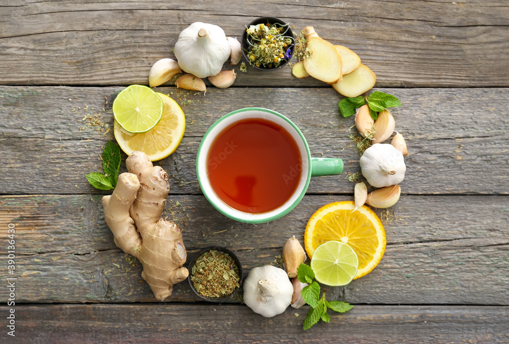 Cup of healthy garlic tea on table