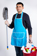 © Viorel - Gender stereotypes, a man in gloves, vabre and chemicals for cleaning the house. Photo on a white background. Cleaning and cleanliness concept