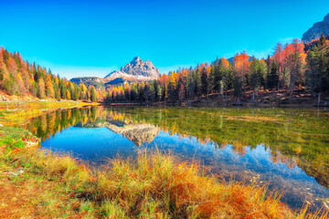 Wall Mural - astonishing view of popular travel destination mountain lake antorno in autumn