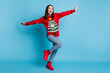 © deagreez - Full size photo of cool girl dance theme masquerade discotheque wear christmas tree decor sweater pullover jeans isolated over blue pastel color background