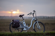 HOGE HEXEL, NETHERLANDS - Sep 30, 2020: Romantic Sunset Moorland Landscape With E-bike