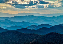 A Wide Landscape Of The Blue Ridge Mountain Layers With Clouds In HDR.