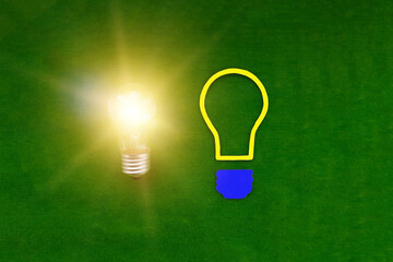 two light bulbs on a green background. ideas, creativity. thinking.