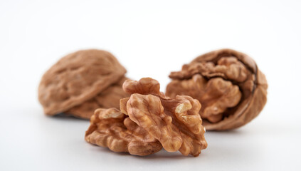 Wall Mural - Walnuts in close-up, isolated on a white background.Space for text