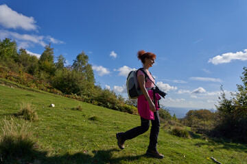 Wall Mural - Backpacker lady in the forest