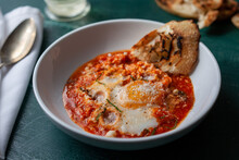 Close Up Of Eggs Poached In Marinara Sauce Served In Bowl