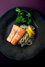 Overhead View Of Roasted Arctic Char With Pine Nut Soba And Meyer Lemon Served On Plate