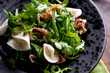 © Andrew Scrivani - Close up of turnip salad with arugula and prosciutto served on plate