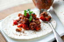 Close Up Of Turkey And Red Pepper Hash On Tortilla