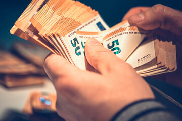 Wall Mural - Counting Euro Banknotes in Hands