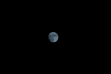 blue full moon in the night sky