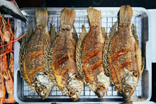 Fried Fish On Tray In Street Food Stall
