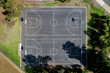 © Neal Pritchard/Stocksy - Overhead aerial views of back outdoor basketball courts with no people