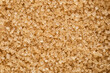 © bukhta79 - brown sugar.unrefined cane sugar.background. Top view. Flat lay. Powerful healthy sweetener.