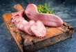 © HLPhoto - Traditional cooked veal tongue with parsley offered as close-up on a rustic wooden board