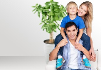 Poster - Beautiful smiling lovely family sitting on sofa