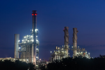 Oil refinery industry at sunset - factory - petrochemical plant