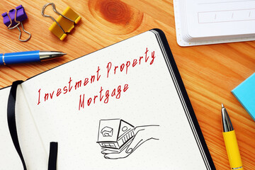 Business concept meaning Investment Property Mortgage with sign on the page.