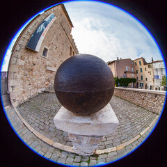 Wall Mural - Antibes, France, October 12, 2019. Typical urban view. Picturesque narrow street in the old city. Fisheye view.