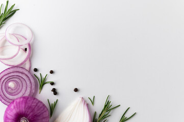 Wall Mural - Background texture red onion Sliced into ring with black pepper and rosemary. Top view Garnish and food ingredients with blank space on isolated white background.