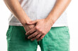 © Ivan Zhdan - male sexual problems. the man's hands cover his groin