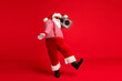 © deagreez - Full length body size view of his he handsome bearded fat overweight cheery Santa listening pop carrying tape player dancing having fun isolated bright vivid shine vibrant red color background