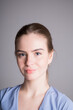 © DmitryStock - Portrait of a caucasian girl with blue eyes on a gray background