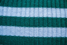 Texture Of Old Green And Blue Striped Knitted Sweaters. Double Ribbing Stitch Knit Fabric Background