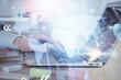 © peshkova - Multi exposure of world map hologram with man working on computer on background. Concept of worldwideweb.