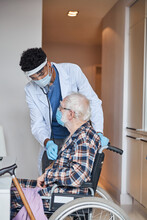 Doctor Performing A Routine Cardiovascular Examination Of A Senior Patient
