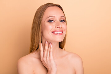 Wall Mural - Close-up portrait of her she nice attractive lovely cheerful confident straight-haired girl applying moisturizing nourishing effective detox sculpturing cream concept isolated over beige background