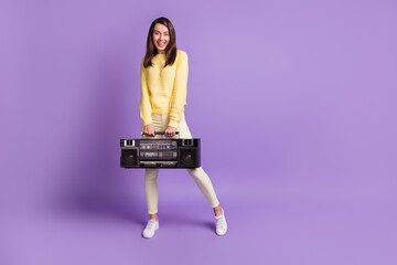 Canvas Print - Full length body size photo of positive girl holding stereo boombox wearing casual clothes smiling isolated on bright violet color background