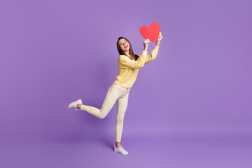 Wall Mural - Full length body size side profile photo of pretty girlfriend showing red heart shaped postcard smiling isolated on vibrant violet color background
