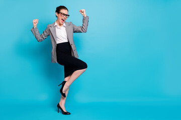 Poster - Full length photo of crazy girl attorney raise fists scream wear grey black blazer stilettos isolated blue color background