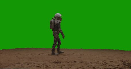 Wall Mural - green screen chroma key astronaut walking on a sandy surface. mars colonization concept