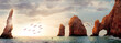 Rocky formations on a sunset background. Famous arches of Los Cabos. Mexico. Baja California Sur. Panoramic image. Banner format.