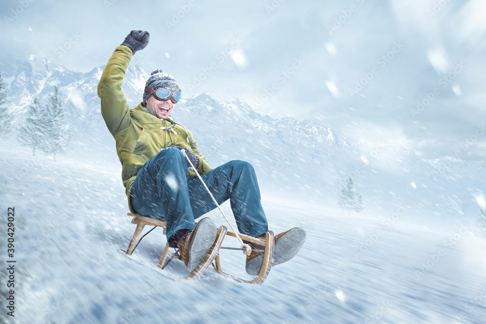 Happy man riding on a sled in winter - obrazy, fototapety, plakaty 