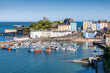 Tenby Harbour which is a popular seaside resort town in Pembrokeshire South Wales and a popular travel destination tourist attraction landmark, stock photo image