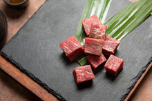 Fresh Raw Beef Brisket Slice Set On The Black Marble Dish Rock. Healthy And Raw Food Concept