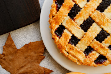 Close up of a berry tart pie on wooden table