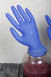 A rubber glove on a can of fermenting grape juice. I was puffed up by the gases released during fermentation. Homemade wine at home.