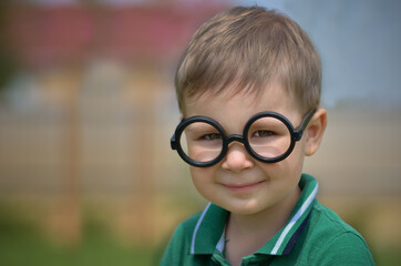 Portrait of a little boy in summer